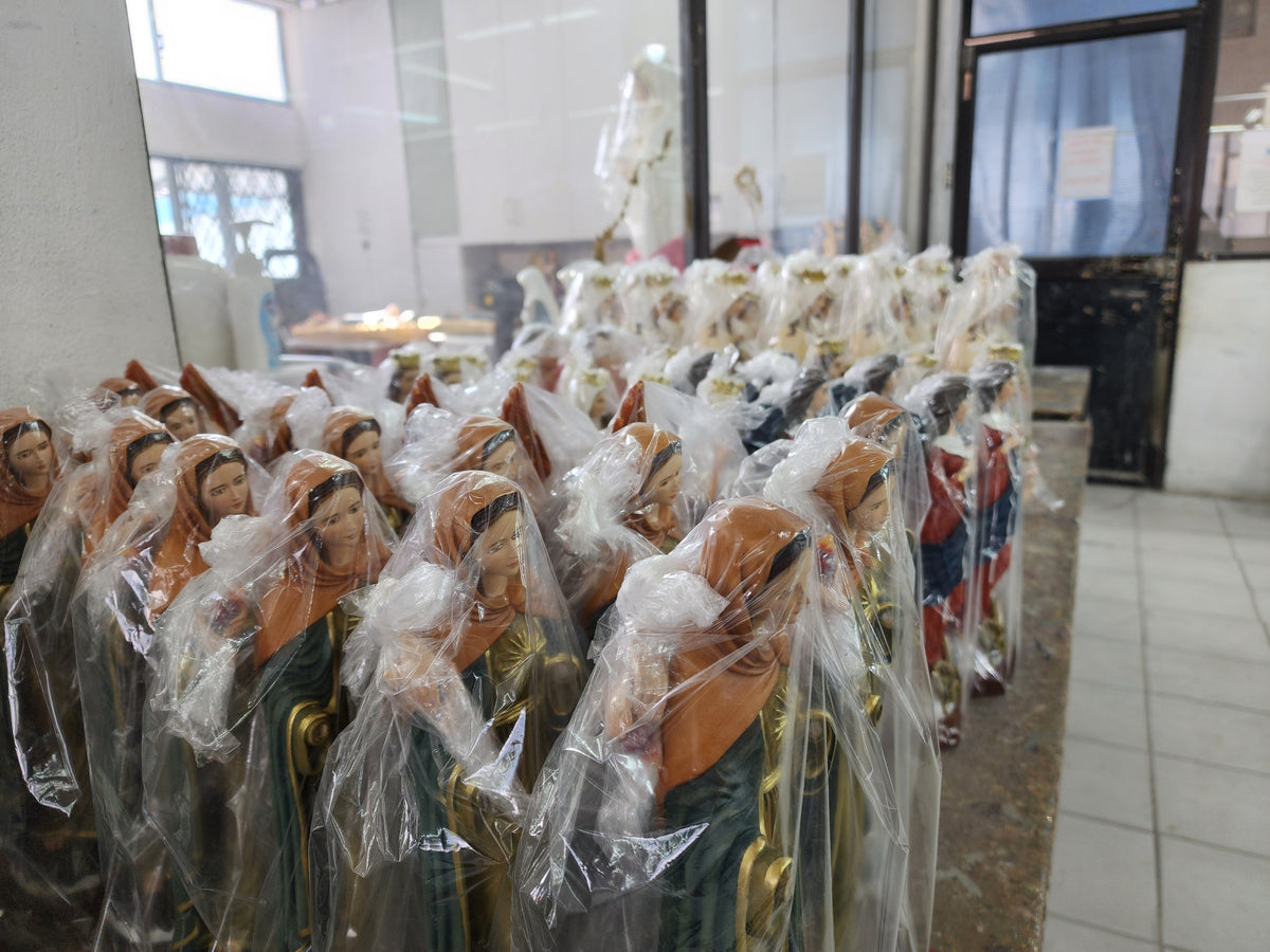 Statues wrapped in foam, ready to be boxed